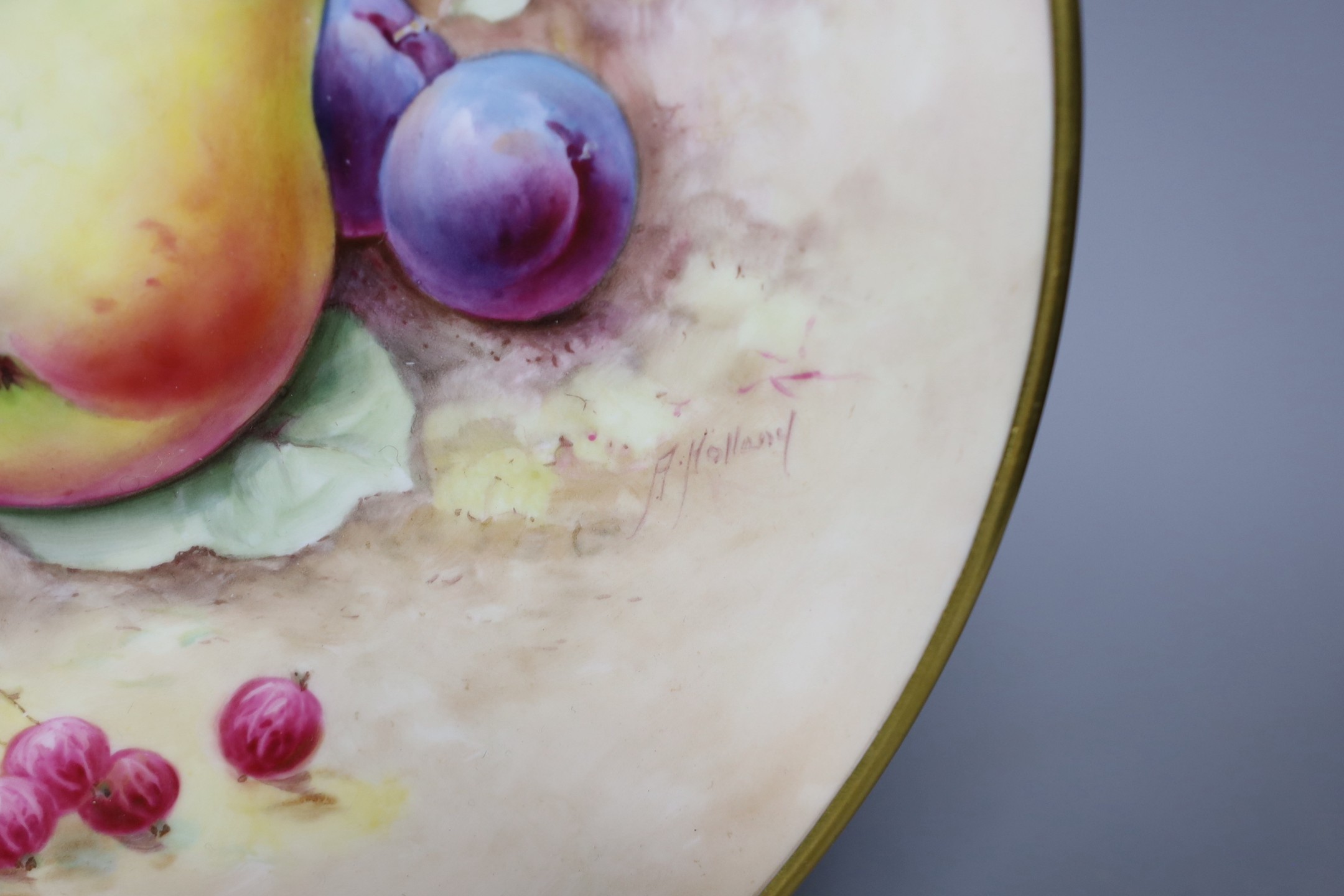 A pair of Minton fruit painted plates, signed A. Holland, 23cm diameter, together with two books on Coalport